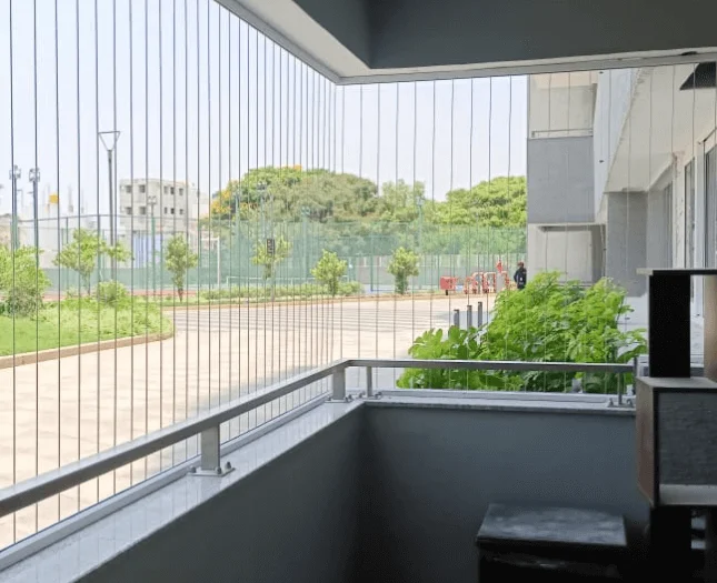 Stainless steel invisible grill on a high-rise window